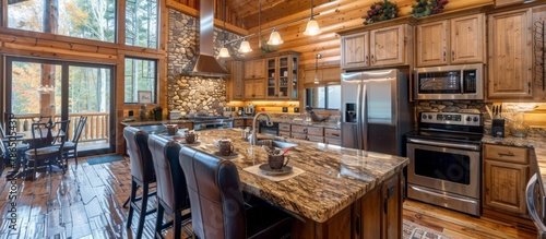 Gourmet kitchen equipped with top-of-the-line appliances and granite countertops elevates cabin living.
