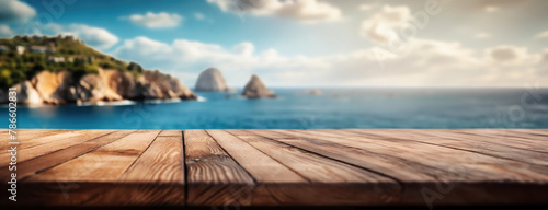 Wooden planks overlook a serene sea with rocky cliffs in the distance. Seascape view is clear, suggesting a tranquil coastal vista.