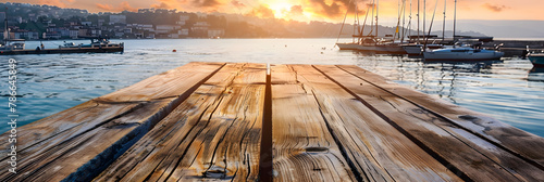 an empty wooden table overlooking the harbor