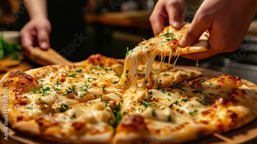 A four-cheese pizza served on a wooden pizza peel with herbs sprinkled around