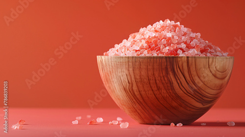 A Wooden Bowl of Pink Himalayan Salt Isolated