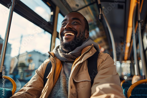 Low angle view of happy man riding in a bus. Copy space 