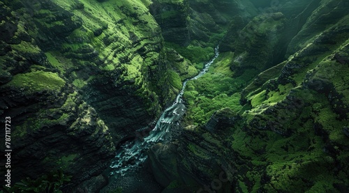 beautiful aerial shot from the sky featuring natural huge beautiful big green mountains with waterfalling into a river flowing between the eco friendly green forest