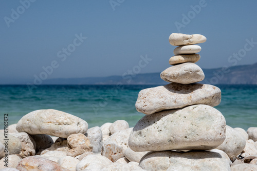 small towers of white pebbles on the beach, on the Greek island of Kefalonia.