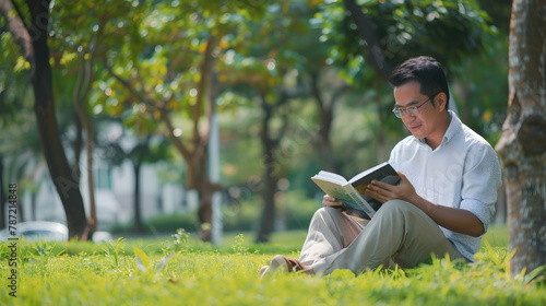 Banner Asian man holding book reading magazine at green park in natural garden Relax man read open book Panorama men happy learning Closeup Men hands open textbook in green park with c : Generative AI
