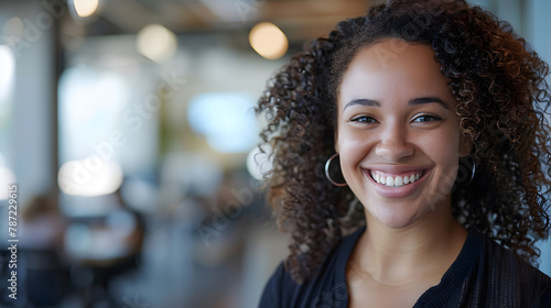 A young biracial woman smiles brightly with copy space she appears cheerful in a welllit office setting : Generative AI