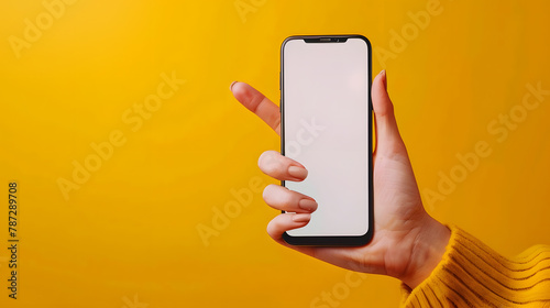 Office woman finger point at smartphone holding device in hand on yellow background Mock up copy space screen Concept of mobile app and business network : Generative AI
