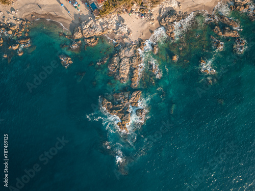 Top down of Conchas Chinas Beach in Puerto Vallarta Mexico showing rock formations in ocean.