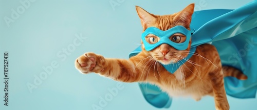 Whimsical Superhero Ginger Cat in Flight with Blue Mask and Cape Against Sky-Blue Background