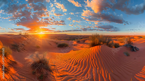 A panoramic view of a desert with sand dunes at sunset, using a wide-angle lens to capture the expansive landscape and vivid colors