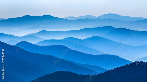 A rugged mountain ridge at dusk, captured with a telephoto lens to compress the distance and enhance the layering effect of the mountains