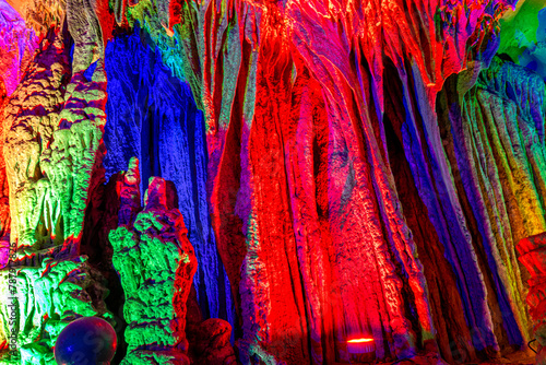 beautiful illuminated multicolored stalactites from karst Silver cave