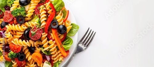 Pasta Salad served with a fork against a white backdrop