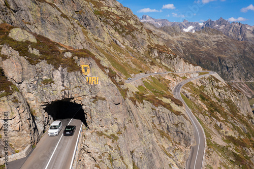 Sunsten Pass, Switzerland: Cars drive through a tunnel along the Susten pass mountain road between the cantons of Bern and Uri in the alps in summer in Switzerland