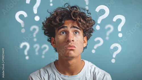 man standing looking very confused with question marks flying over his head