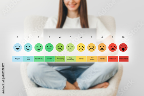 pain measurement scale. Colorful set of emotion icons. A girl with a laptop checks her mood scale