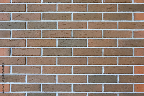 Brown brick wall texture with white grout