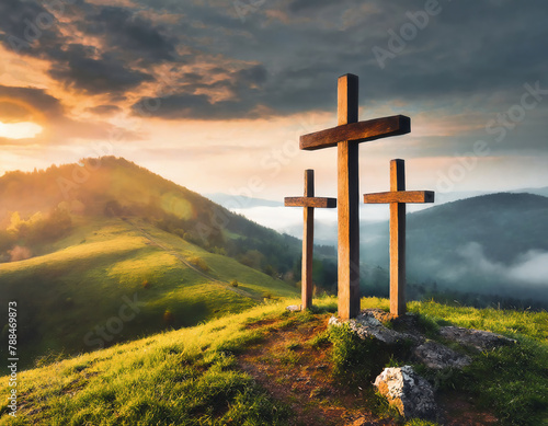 Wooden crosses on the top of the mountain with clouds at sunset