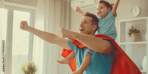 Superhero Dad, happy father and son playing super hero game at home, concept of Father's Day, family, love.