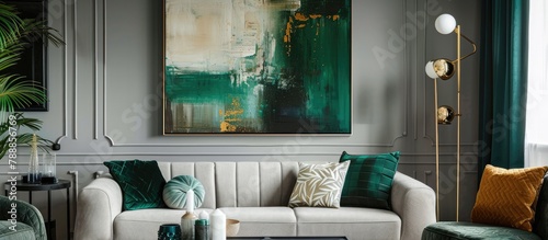 Interior design featuring an abstract painting on the wall, styled in emerald green and grey for a chic living room.