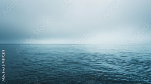 Peaceful ocean expanse under overcast skies in soothing shades
