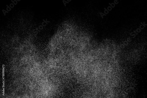Abstract splashes of water on black background. White explosion. Light clouds overlay texture. 