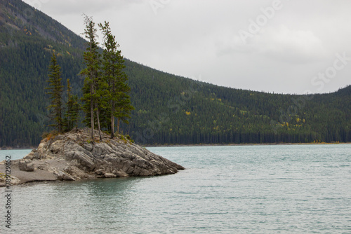 Cloudy Day on Rocky Island in Lake Minnewanka, Canadian Rocky Mountains, Banff National Park