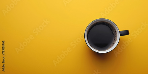 A cup of black coffee on a yellow background,