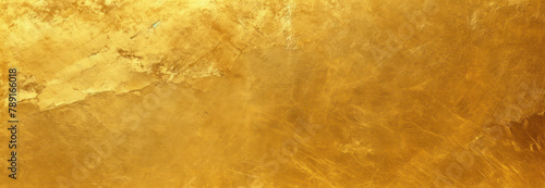 Gold metal texture background with scratches and cracks, shiny golden foil surface for luxury design or packaging decoration.