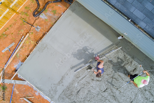 New driveway for house has been poured with wet cement