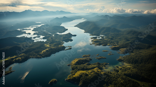 Aerial view of tropical watershed with mountains in the background and a gentle tide.