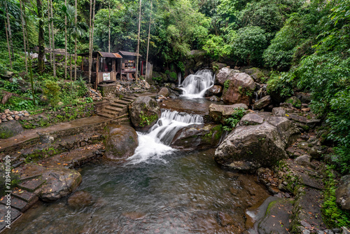 Beautiful Natural Double Decker Living Root Bridge. The legendary double-decker root bridge and waterfall at Nongriat village near Cherrapunji, in northeast India's Meghalaya State