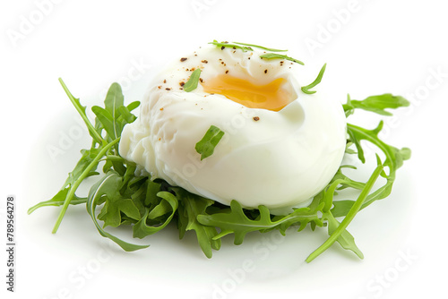 One poached egg and arugula isolated on white background