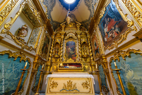 The ornate interior nave and chapel inside the 18th century St. Peter's Catholic Church, or Igreja de São Pedro, in the historic old town district of Funchal, Portugal, on the Canary Island of Madeira