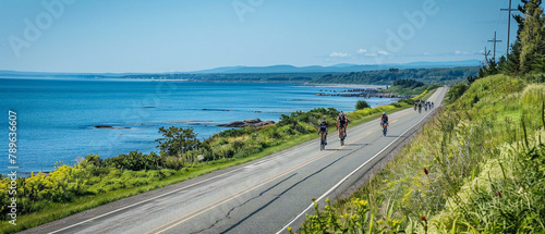 Cyclists race along coastal roads with stunning ocean views during a scenic bicycle race.
