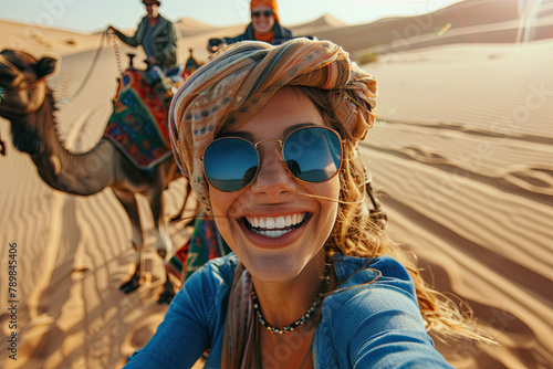 Joyous traveler partaking in a group camel ride in the desert - Adventures, lifestyle, holiday pursuits