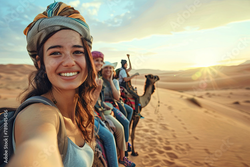 Joyous traveler partaking in a group camel ride in the desert - Adventures, lifestyle, holiday pursuits