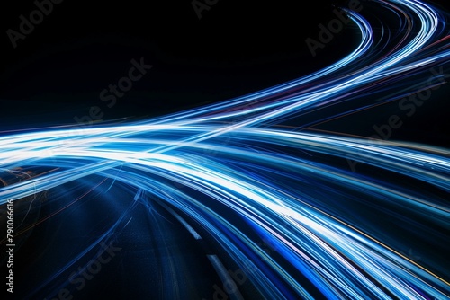 Dynamic blue and white light trajectories on a dark backdrop with long exposure
