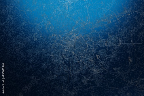 Street map of Lyon (France) engraved on blue metal background. View with light coming from top. 3d render, illustration