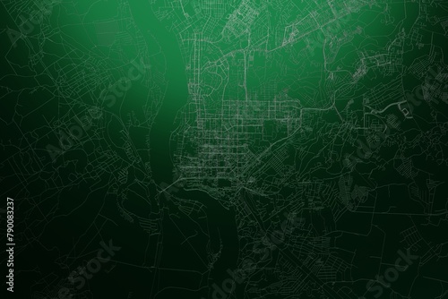 Street map of Tomsk (Russia) engraved on green metal background. Light is coming from top. 3d render, illustration