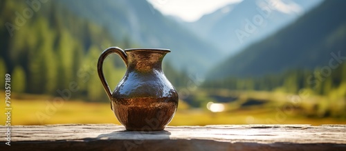an ancient brown porcelain teapot left by ancient ancestors with a mountain garden in the background