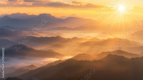 Golden rays of dawn cascading over tranquil mountain ridges in a majestic sunrise panorama