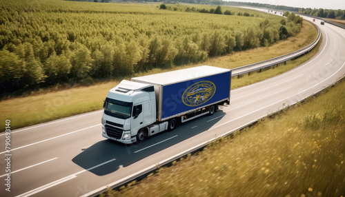 An Nebraska-flagged truck hauls cargo along the highway, embodying the essence of logistics and transportation in the Nebraska