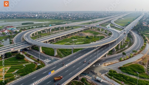 A birdseye view of a bustling highway interchange in a metropolitan area