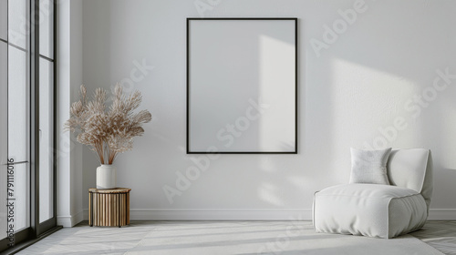 habitacion minimalista con gran ventanal, decorado con un cuadro blanco vacio sobre pared clara, sillon blanco textil adornado con cojines y mesita redonda de madera con jarrón y planta de interior