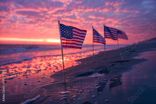 American flags on the beach at sunset, commemorating memorial day