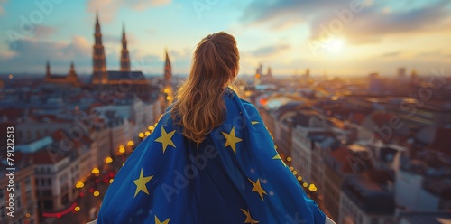 Wearing a blue cape featuring yellow stars, a young woman observes the city of Brussels from the rear, waving the European Union flag