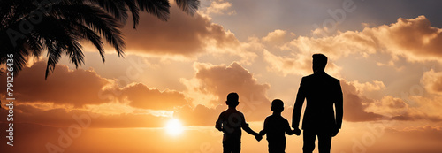 Loving father walking side by side with sons holding hands in sunset. Happy fathers day.