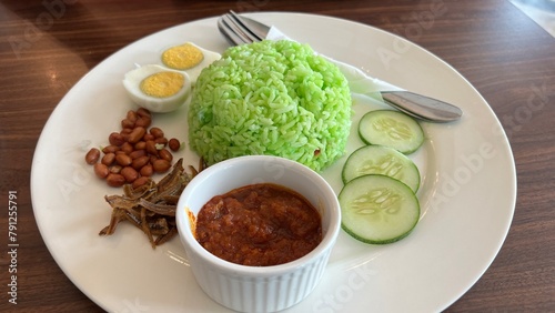 Nasi Lemak ,Nasi Pandan famous South East Asian dishe made with rice closeup with selective focus and blur