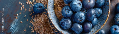 A sprinkle of golden flaxseeds mingles with a handful of plump blueberries and a dollop of creamy almond butter, a breakfast bowl bursting with superfood potential
